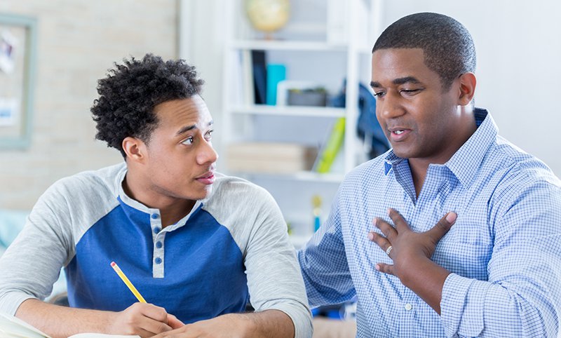 Two men talking and learning together